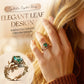 Ring mit grünem synthetischem Kristall und filigranem Blattdesign