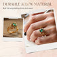 Ring mit grünem synthetischem Kristall und filigranem Blattdesign