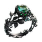 Ring mit grünem synthetischem Kristall und filigranem Blattdesign